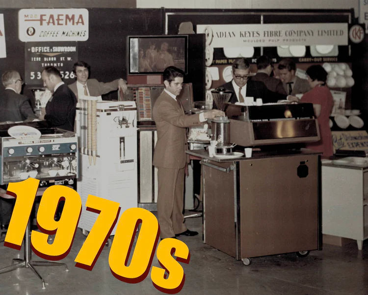 The Faema Canada booth at a 1970s trade show, staffed by salesmen in suits with espresso machines on display